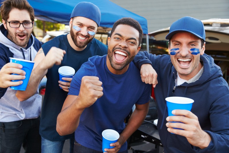 Fans celebrating at the tailgating party